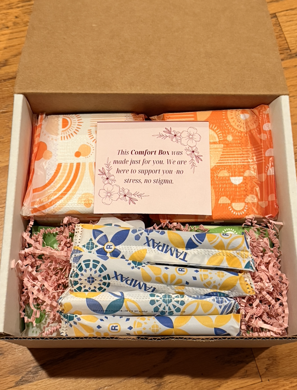 Inside a Comfort Box with products and a supportive note
